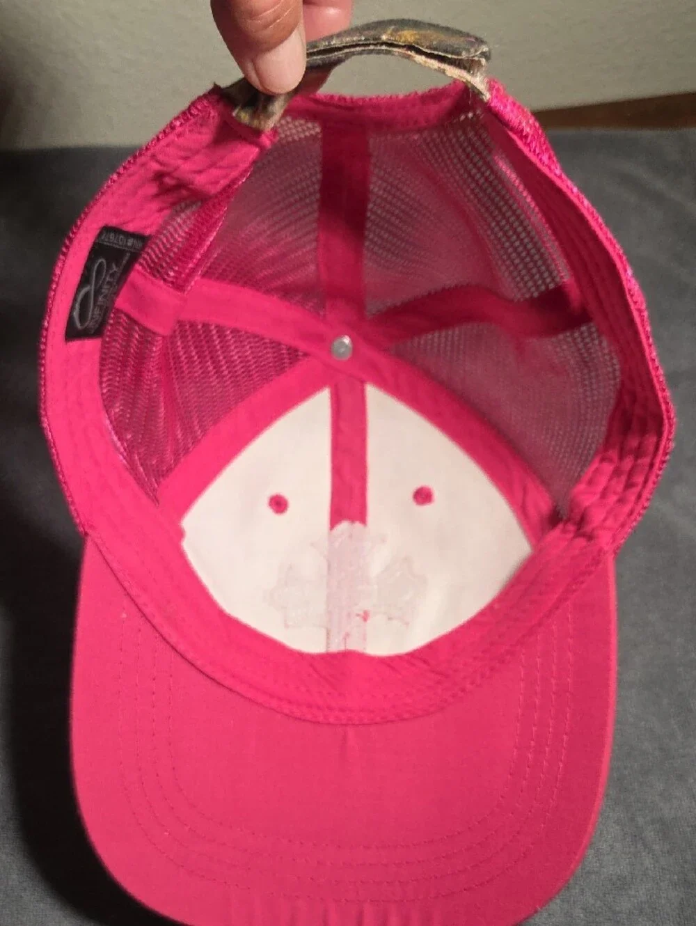 NFINITY New Camo Trucker Hat with Pink Cross Accent